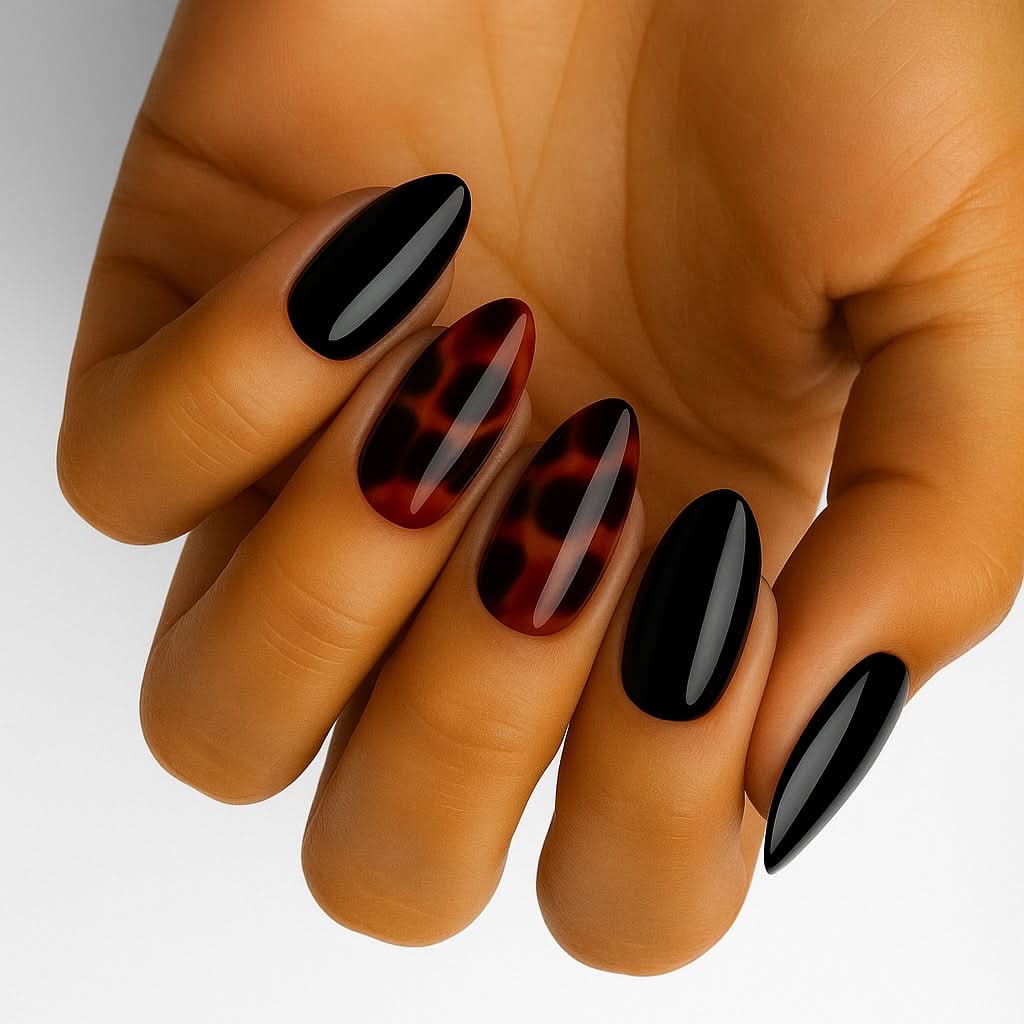 Tortoiseshell Noir (Non-UV Nail Wraps): close-up of almond nails mixing glossy black and tortoiseshell